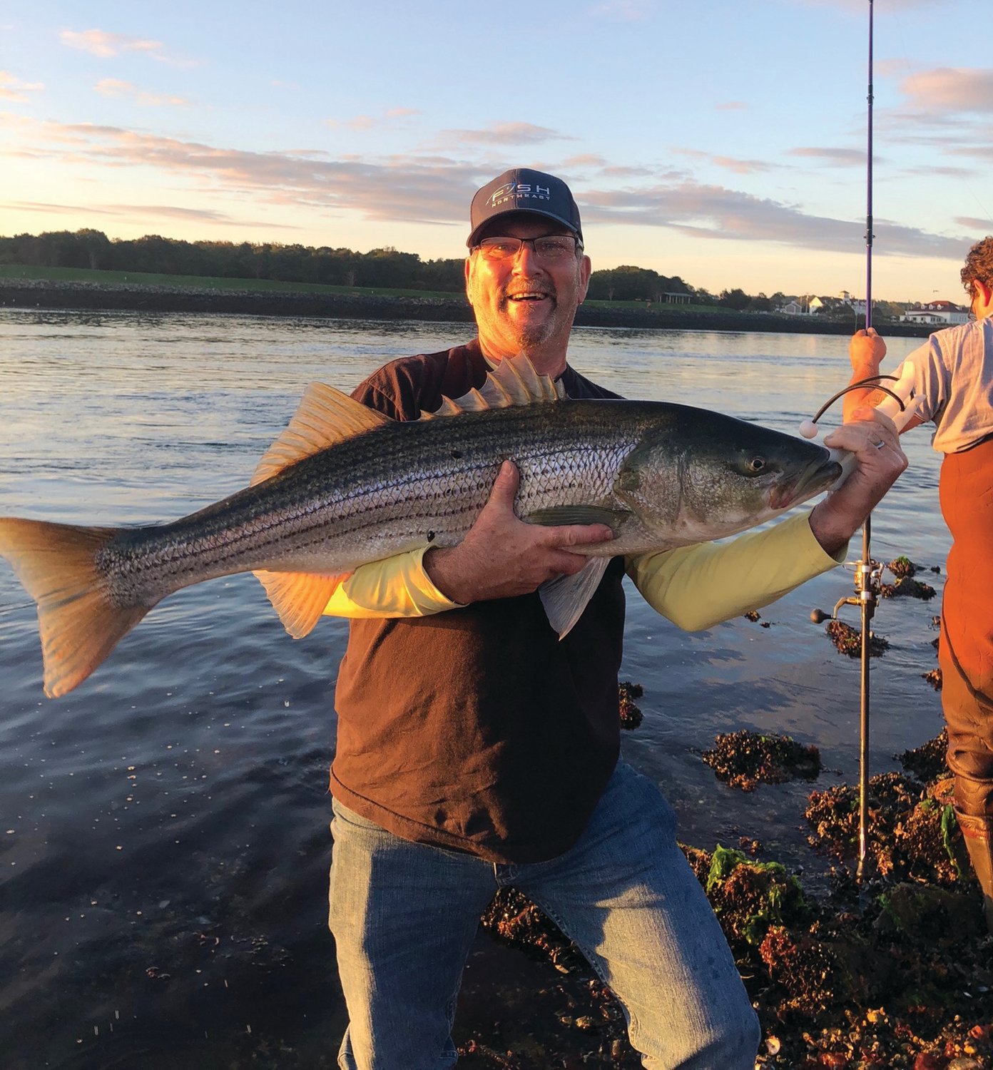 STIPED BASS: Fred Creager of Plymouth with the 43-inch striped bass he caught on the Cape Cod Canal last week. 